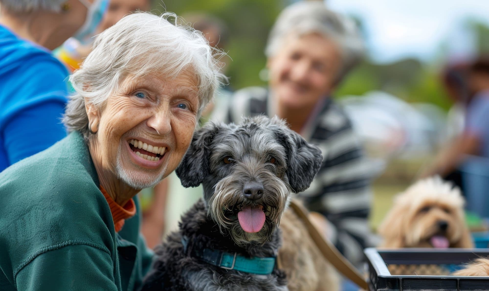 Smiling older adult with dog